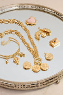 Gold-toned chain necklace featuring heart-shaped pink enamel pendant and octagonal locket charm ideal for 18k gold jewelry gifts.