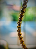 Gold chain with intricate links and polished 18k gold finish showcasing fine jewelry for every occasion