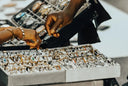 A selection of silver and gold-toned wristwatches in a white tray highlighting fine jewelry and art gold financing options