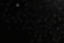 a blurry photo of a street light in the dark