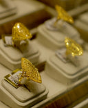 A golden 18k gold jewelry ring with intricate filigreed leaf design perfect for fine jewelry gifts from experts