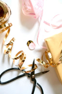 Shiny golden metallic ribbon in handmade 18k art gold jewelry