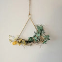 a gold and green pendant