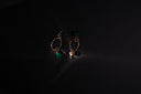Handmade gold teardrop earrings with faceted green gemstones