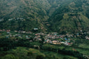 a small village nestled in a valley surrounded by mountains