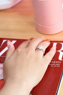 A woman's hand on top of a magazine