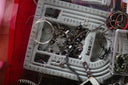 Gray plastic beadsmith bead organizer with measurement markings for storing fine jewelry and 18k gold components.