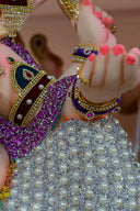 A close up of a statue of a person wearing a costume