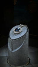 A stunning deep blue sapphire pendant set in platinum with diamonds featured among royal jewels and 18k gold jewelry