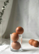 Fabergé eggs inspired by imperial treasures in glass cup stack
