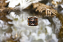 A two-toned engagement ring with black and rose gold bands featuring heart-shaped diamond settings at everett jewelry store