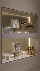 Silver studded handbag with textured quilted surface and structured shape for art gold jewelry concealment