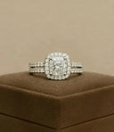 A radiant cushion-cut diamond ring with halo and pavé stones set in white gold band for fine jewelry and gold jewelry investment.