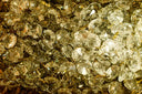 Clear faceted crystal beads with gold-toned metal hooks featured in fine jewelry inspired by larger than life diamonds