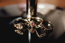 Three ornate art deco gold rings with ruby and diamonds