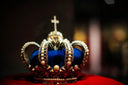 Regal 18k gold crown jewels with pearls, diamonds, blue velvet, cross