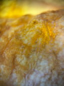 Close-up of translucent yellow-white mineral, legendary largest gold nugget inspiring art gold jewelry