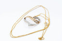 A two-tone gold and silver heart-shaped pendant necklace with love you engraving and diamond accents in fine jewelry style