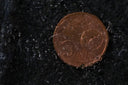 Worn Roberto Coin 50-cent piece with dented edge in royal jewels
