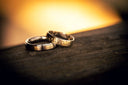 Luxury gold jewelry: interlocking wedding bands with gold-tone dots