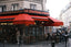 a group of people outside a restaurant