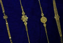 Gold floral-designed necklaces with intricate mesh and beadwork showcasing art gold jewelry by rinaldo borges
