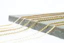 Gold chain necklace crafted from delicate gold metal rings showcasing elegant 18k gold jewelry styles