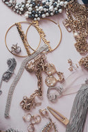 Gold hoop earrings with engraved names reflecting jewelry history and inspired by royal jewels in ancient myths