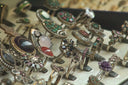 A collection of ornate vintage-style gold rings with colorful gemstones showcasing heirloom jewelry design