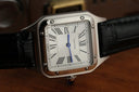 Silver-toned Cartier watch with white dial black leather strap and blue hands featured in art gold jewelry discussion