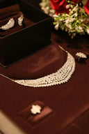 A multi-tiered silver-toned diamond necklace with intricate design complements fine jewelry and 18k gold trends