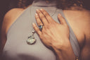 woman holding her chest close-up photo