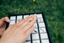 persons left hand on black metal frame