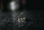 gold ring on black and white surface