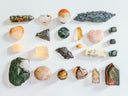assorted color of stone on white table