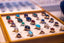 blue and green marble beads on brown wooden board