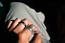 silver ring on persons ring finger