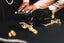 a person wearing a black glove holding a keyboard
