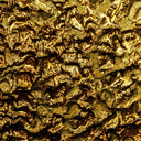 a close up view of a gold textured surface