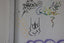 a white wall with some graffiti on it
