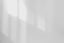 a black and white photo of a white wall