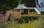 a van parked in a yard