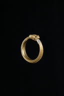 a gold ring with a snake on it