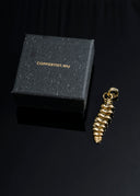 a black box with a gold necklace in it