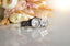 a watch sitting next to a bouquet of flowers