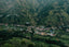 a small village nestled in a valley surrounded by mountains