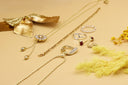 a bunch of jewelry laying on a table