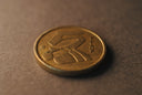 A close up of a coin on a table