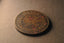 A coin sitting on top of a table