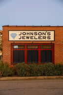 A building with a sign that says johnson's jewelers